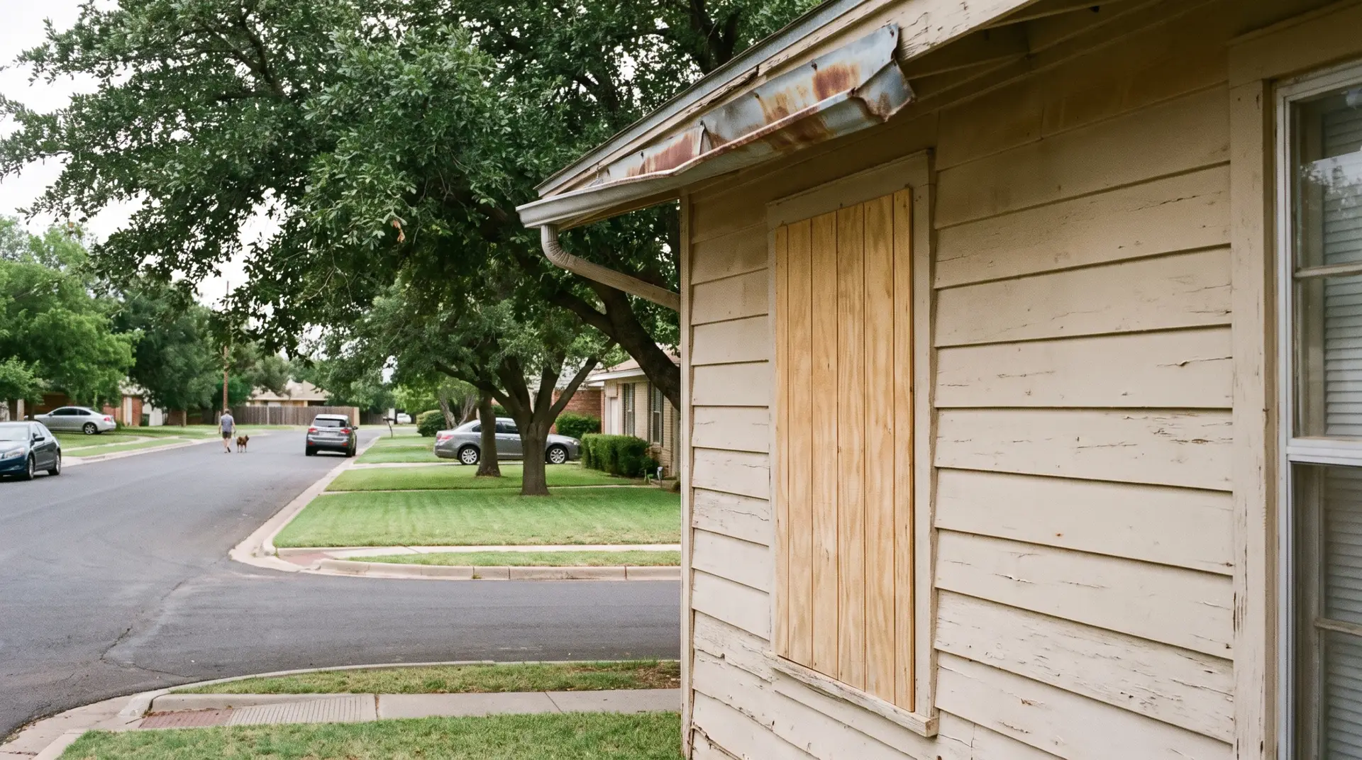 Repaired siding and trim on a West Texas brick home after storm damage restoration