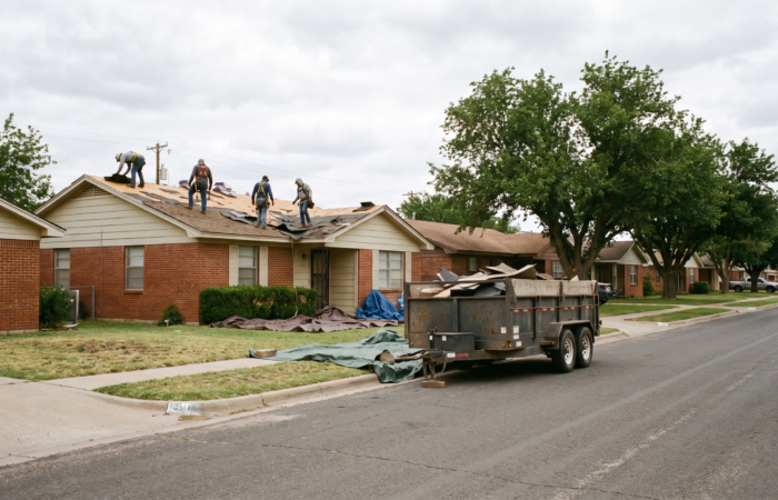 Idalou roofing crew installing architectural shingles on a farmhouse northeast of Lubbock
