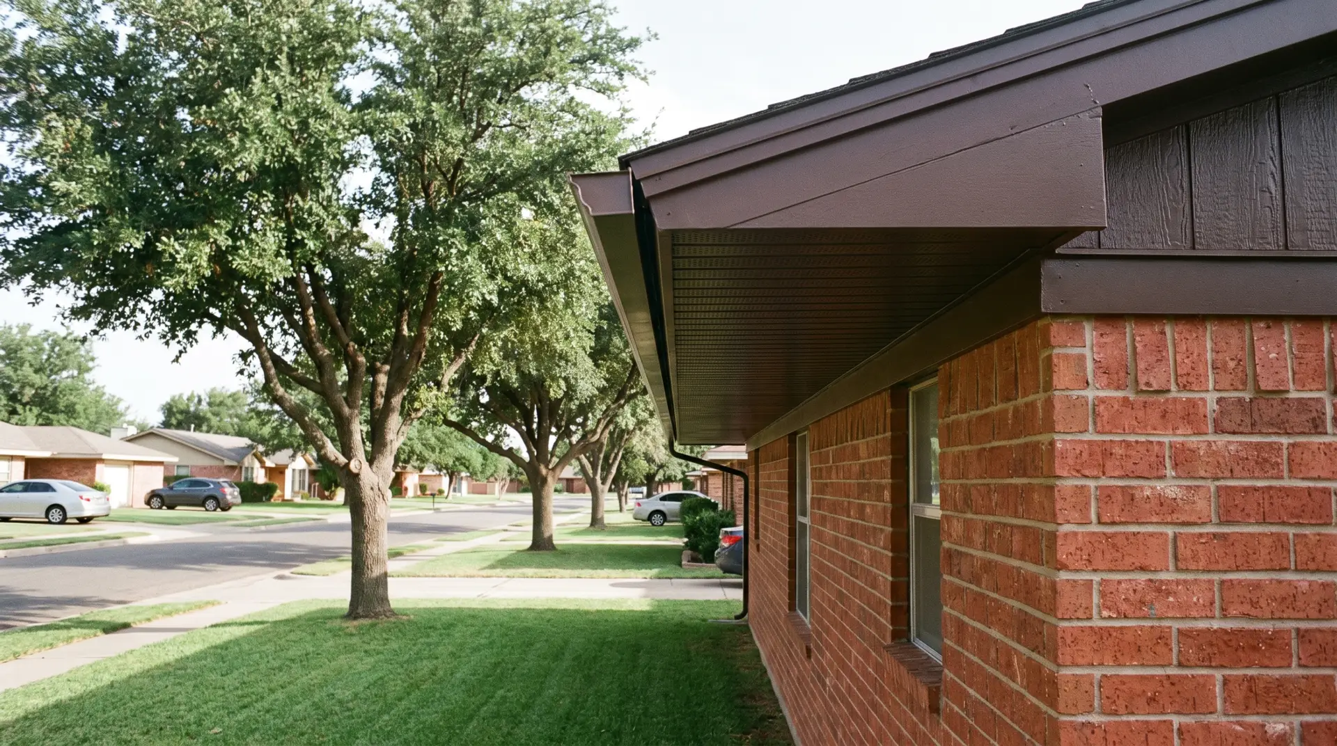 Newly installed vented soffit and painted fascia under a residential roof overhang